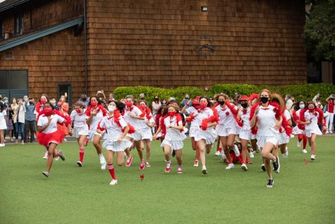 Seniors, dressed in red, run across the circle during the Tie Ceremony on Opening Day.