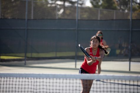 Monica Sidana 23 practices tennis after school.