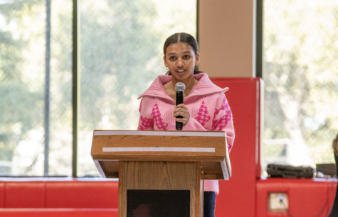 Araika Ramchandran addresses the student body in the Upper Gym during an Anti-Racism Community Workshop with Michelle MiJung Kim.
