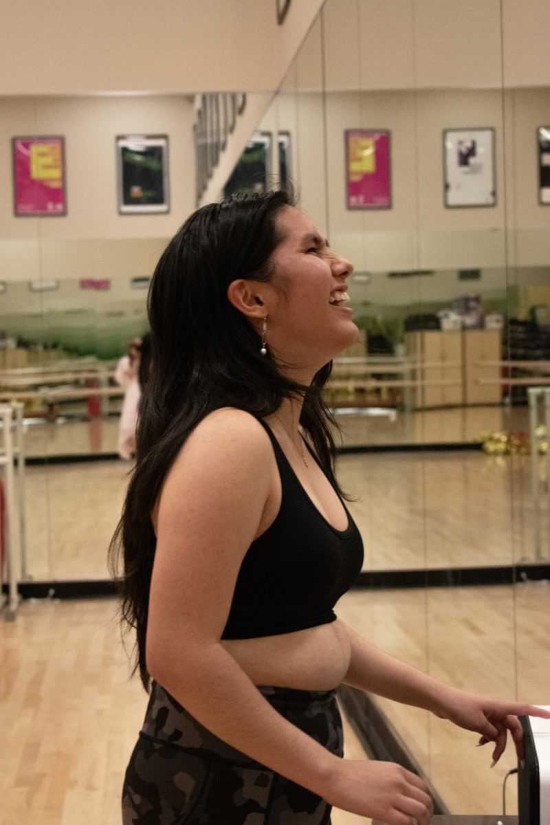 Caroline Silva 24 preparing to rehearse her dance choreography for college prescreens.