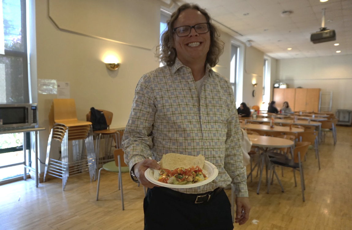 Ian Van Wert poses with his lunch. Photo taken by Kaycie Nuckles and Deeksha Venkat.