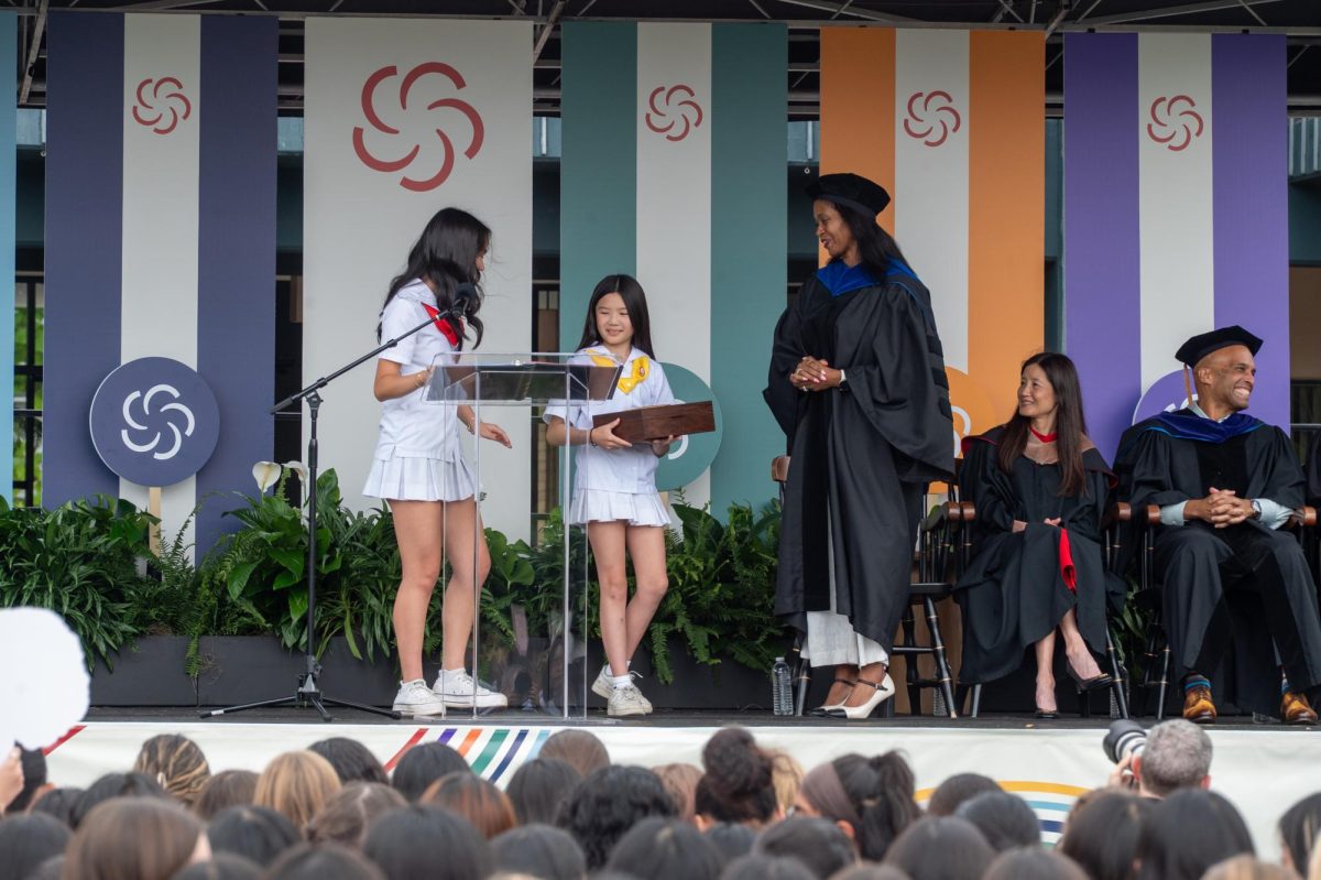 Students give Noel-Pierre a special gift at her installation ceremony.